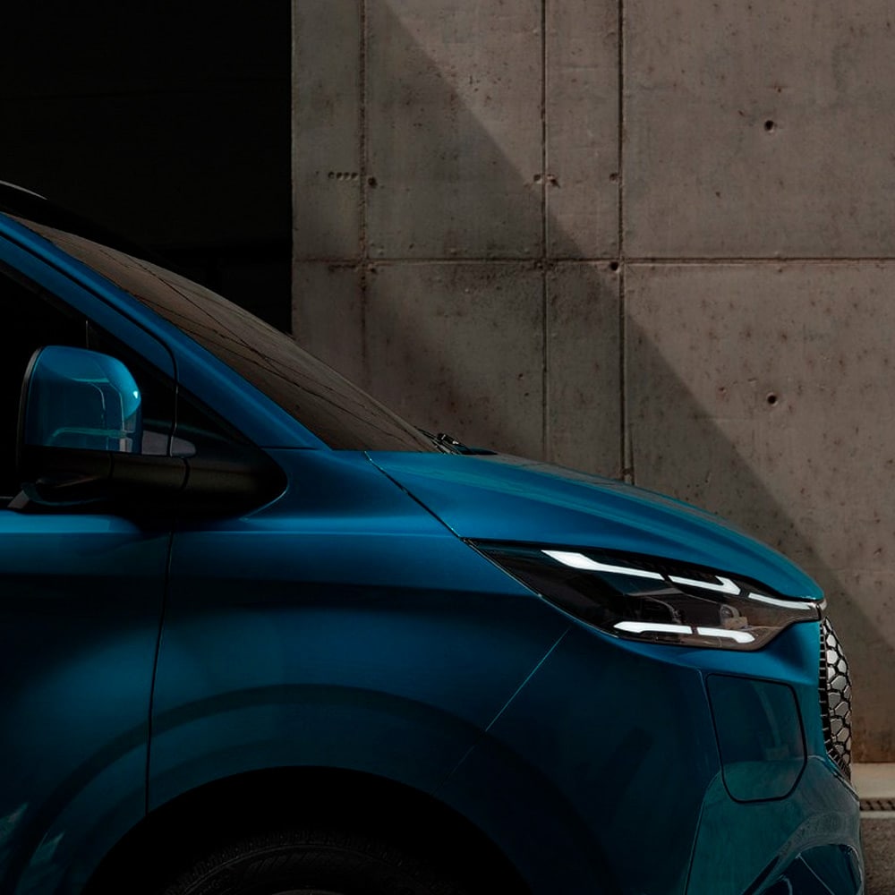 Close-up of a blue Ford electric van.