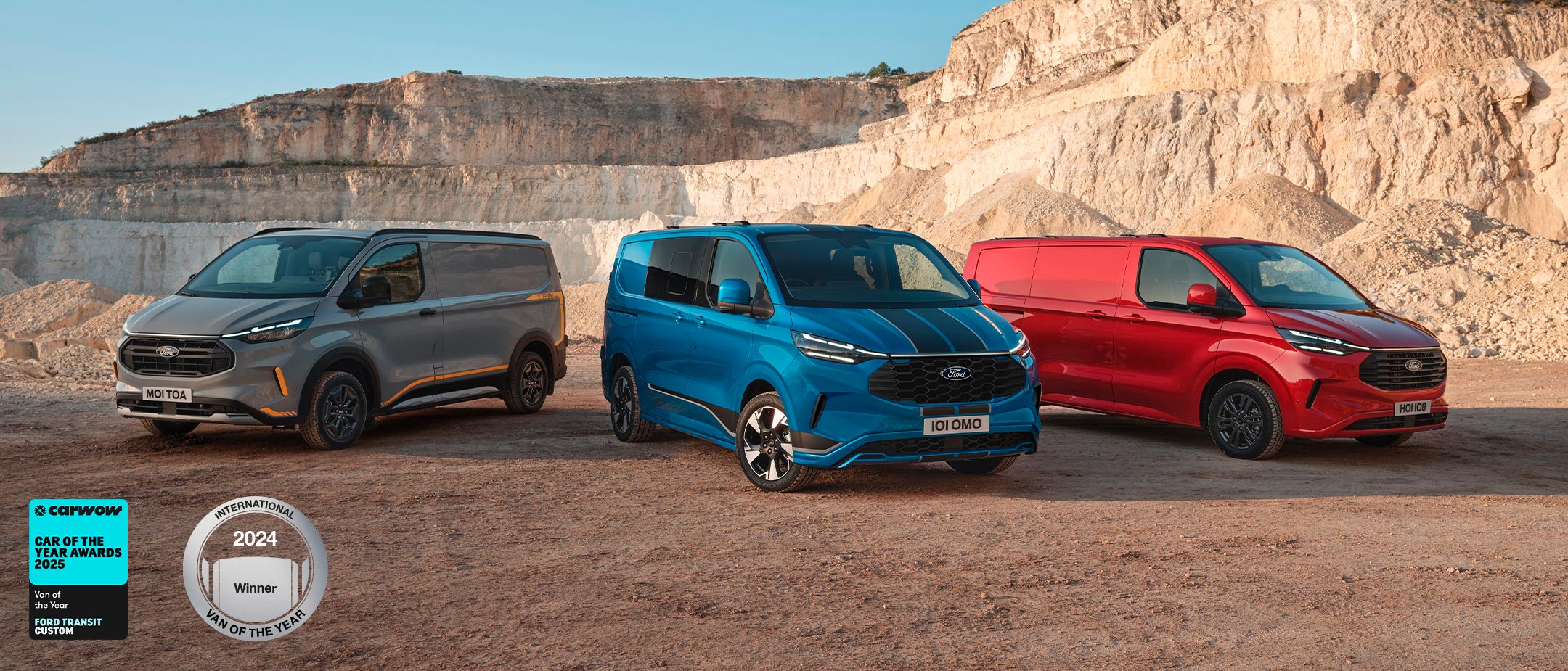 Three Ford Transit Custom Vans in grey, blue and red, parked side by side