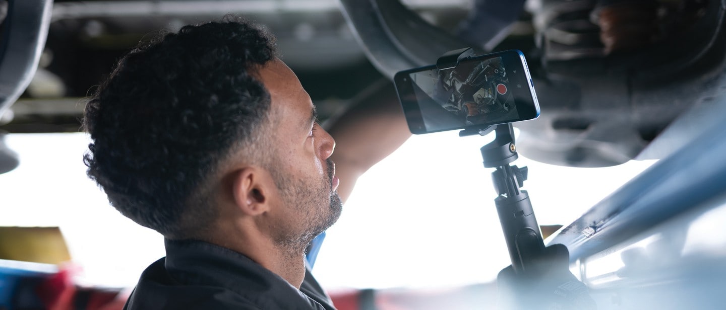 Ford service engineer, under the car chassis